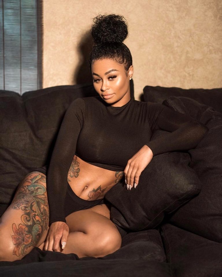 Blac Chyna nearly naked on a couch